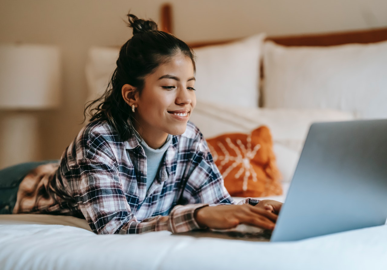 website UX elements girl scrolling on laptop